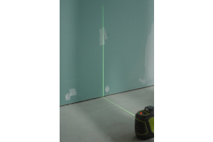 blue plasterboard with a green level shining across the middle of it
