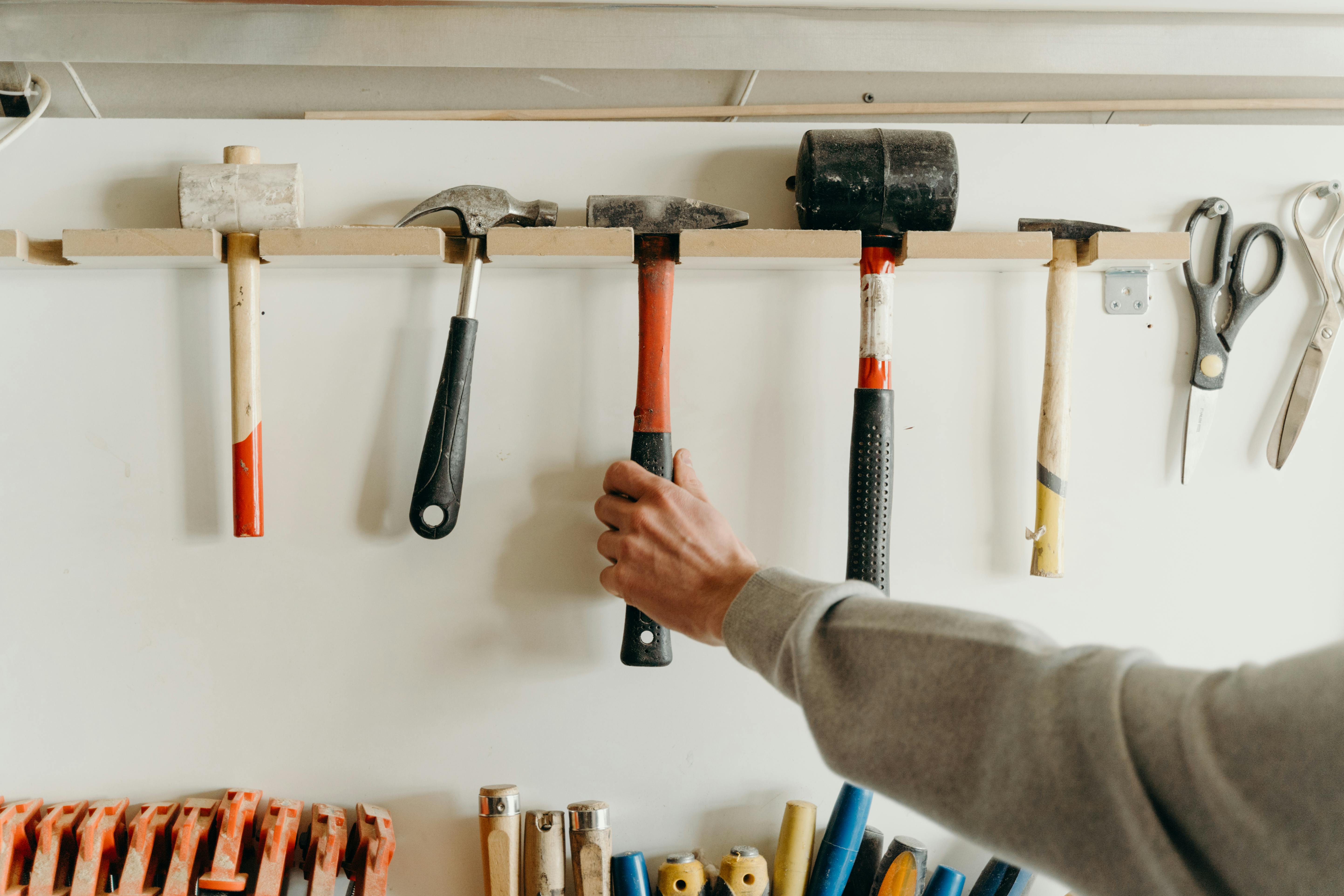 A row of hand tools on a wall